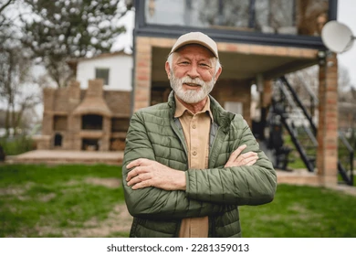 Homeowner standing in front of his house